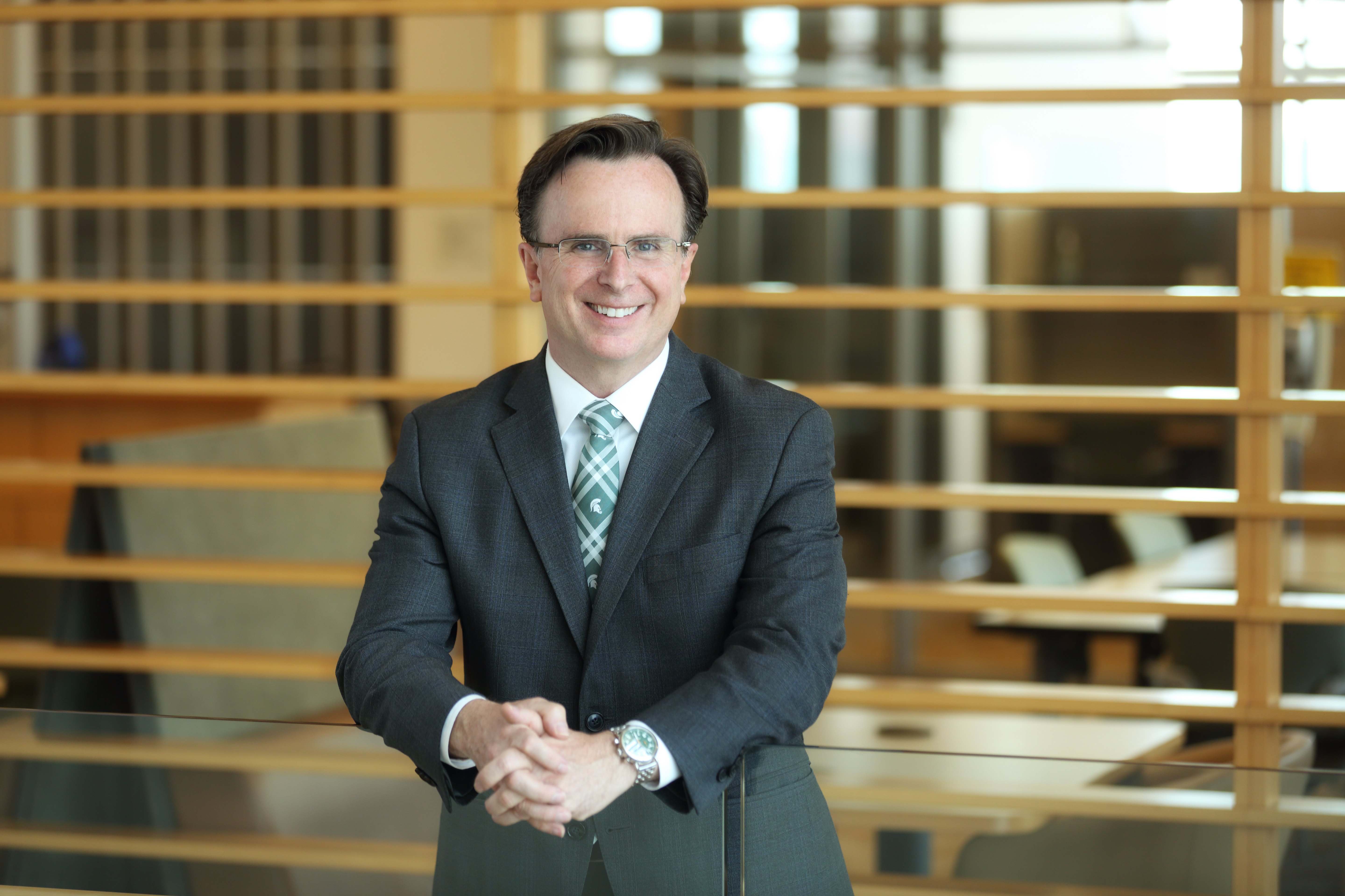 Alumnus Norman J. Beauchamp Jr., MD ('90), FACS posed in the Secchia Center.